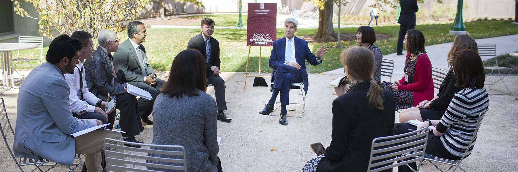 John Kerry and students talk at Indiana University